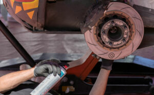 experienced mechanic changing the breaks of a car in a mechanic shop