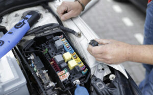 closeup of a mechanic doing a car diagnosis