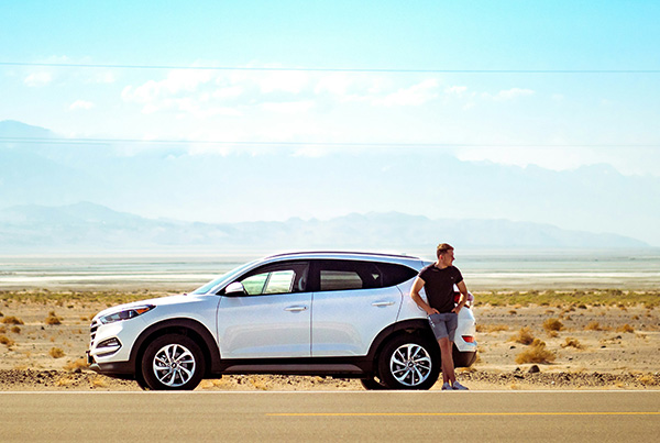 a man stranded on the side of the road wondering why his car won't start